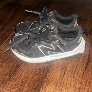 New Balance Kid's DynaSoft 545 running shoes in black and white size 12